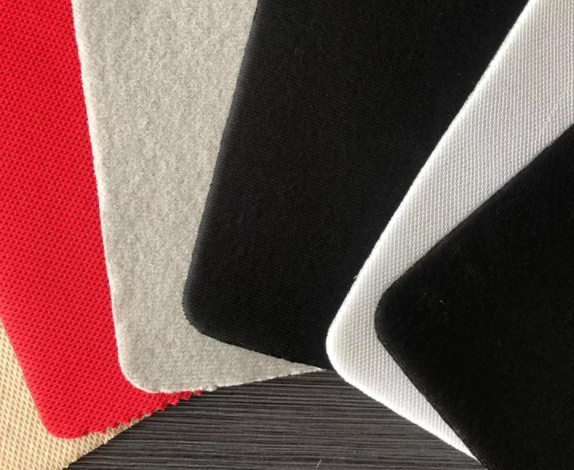 Tessuto laminato con spone